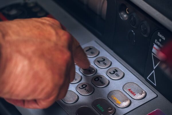 person holding gray and black control panel